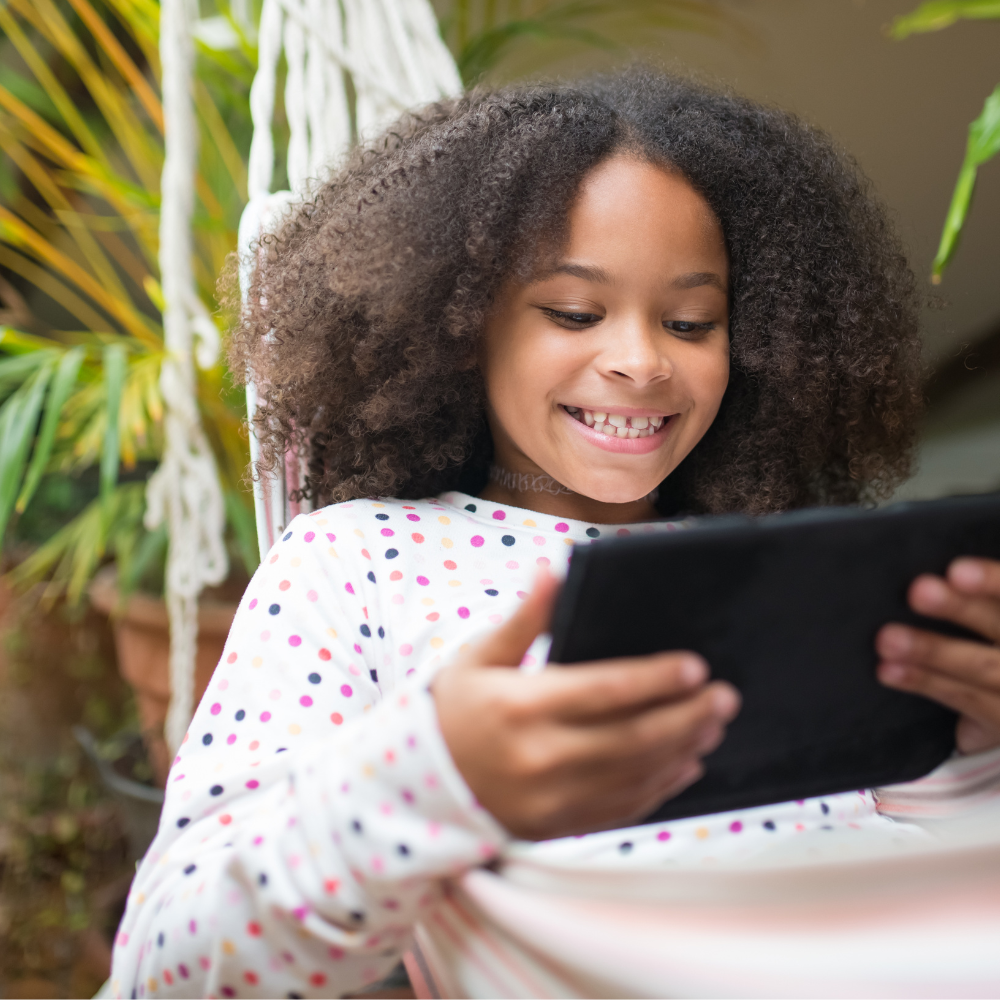 Child using ipad or tablet.