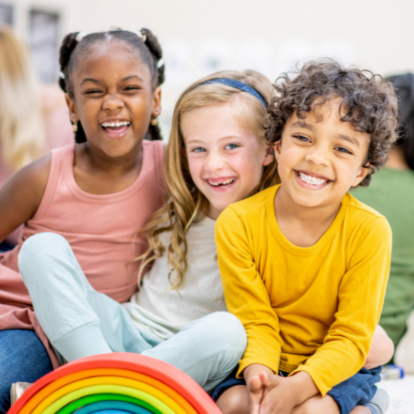  Children laughing together.